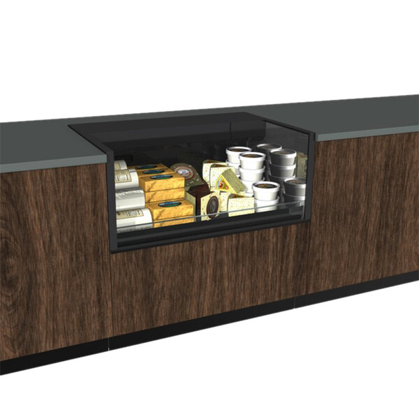 A Structural Concepts black glass air curtain display case on a counter full of food.