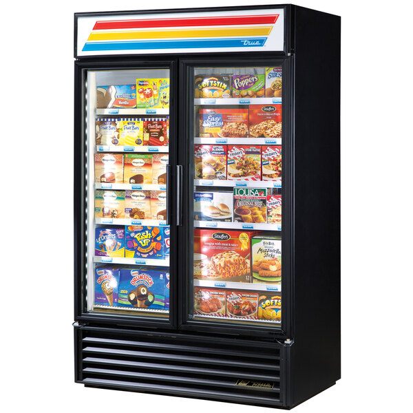 A black True glass door merchandiser freezer with a variety of frozen foods.