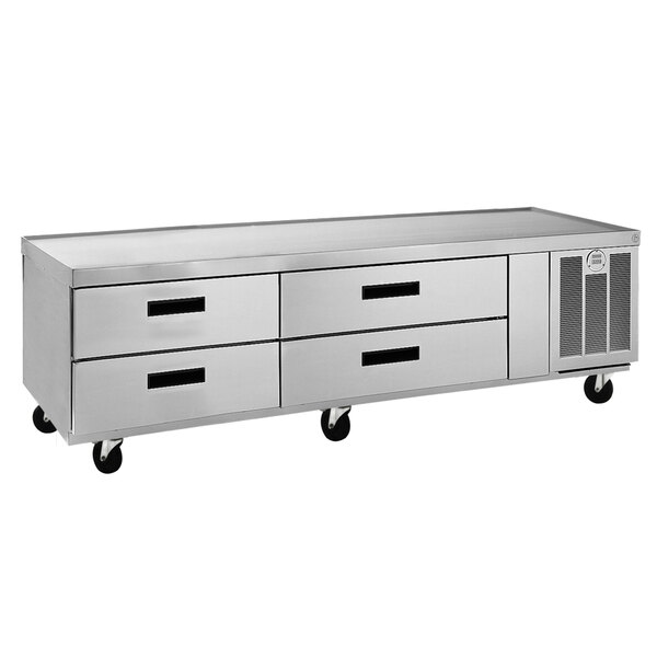 A Delfield stainless steel chef base with drawers.