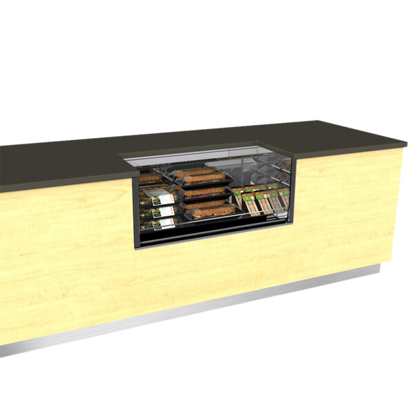 A Structural Concepts Oasis black undercounter air curtain merchandiser on a counter with food in it.