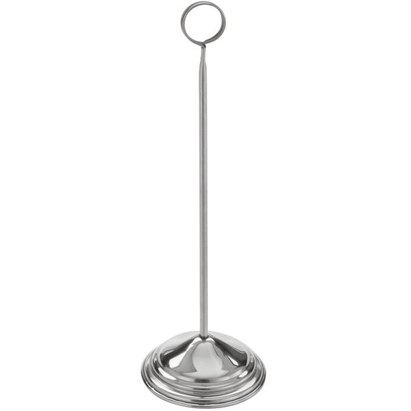 An American Metalcraft stainless steel number stand with a ring on top and a long silver pole.