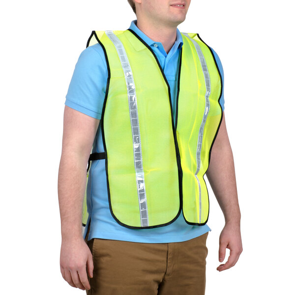 A man wearing a yellow Cordova high visibility safety vest.
