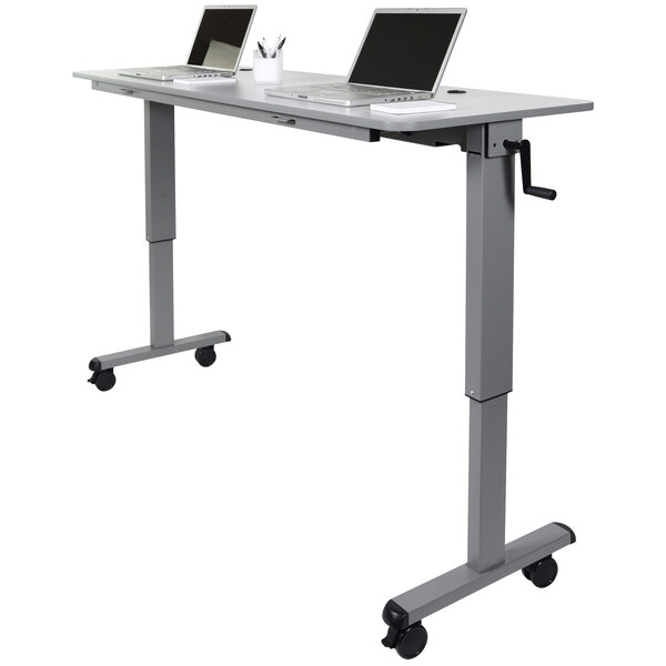 A Luxor adjustable height nesting table with laptops on it.