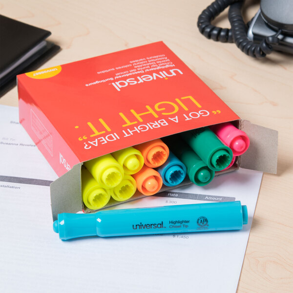 A box of Universal chisel tip highlighters on a desk.