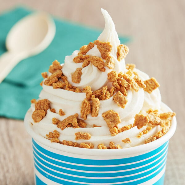 A cup of ice cream with Chopped Golden Graham topping.