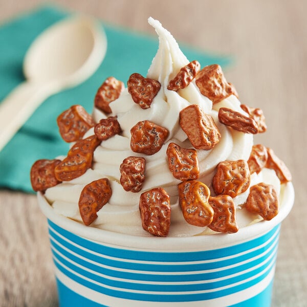 A cup of ice cream with Salted Caramel Chocolate Rocks on top.