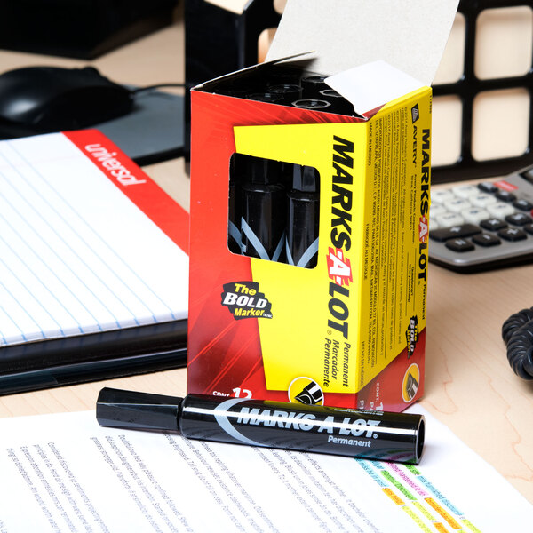 A box of Avery Marks-A-Lot black desk style permanent markers on a desk.