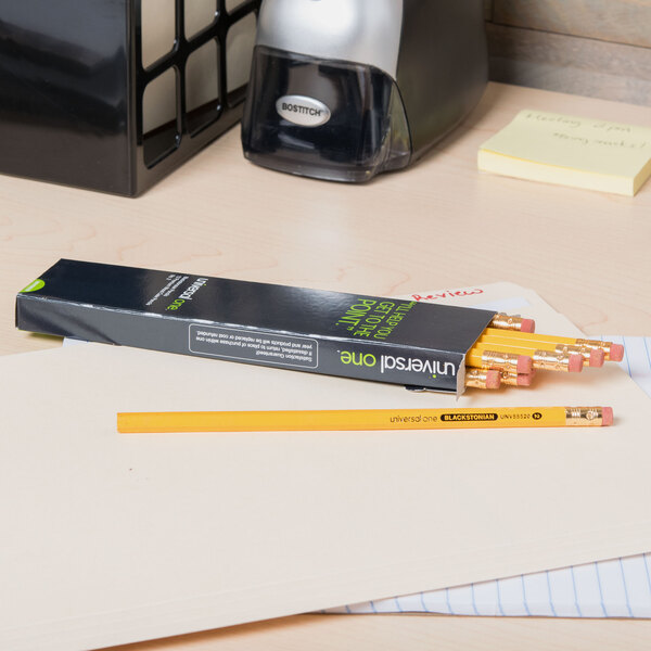 A black box of Universal One Blackstonian pencils on a desk.