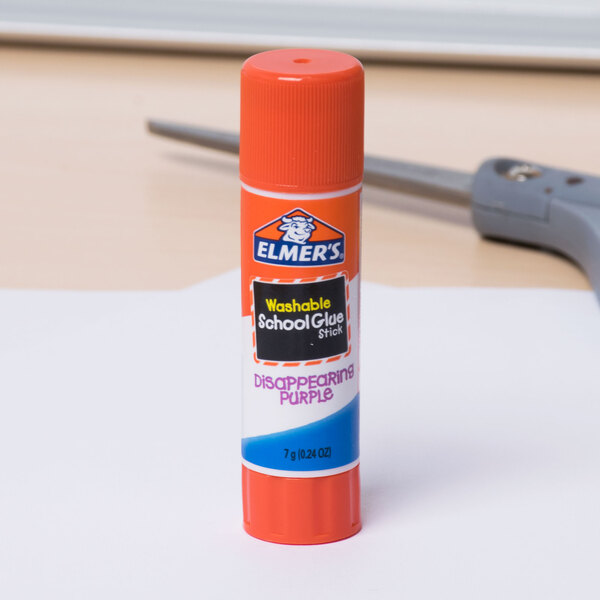 An Elmer's Disappearing Purple School Glue Stick on a table.