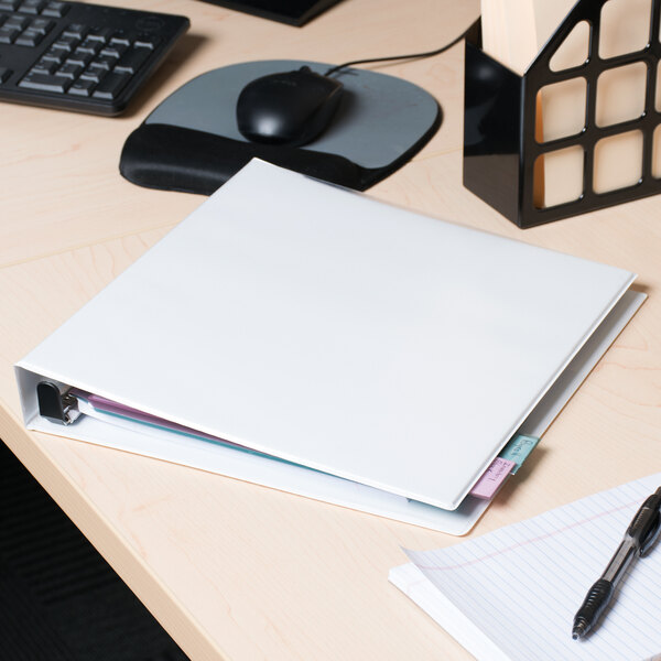 An Avery white heavy-duty non-stick view binder on a desk.