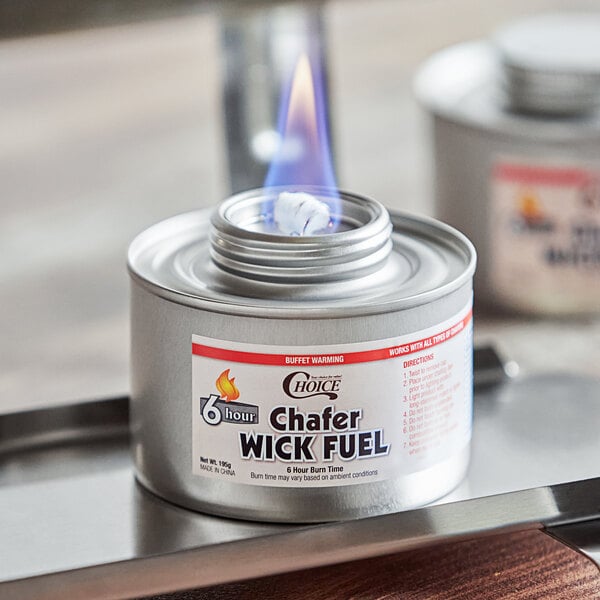 A container of Choice 6 Hour Wick Chafing Dish Fuel with a flame.