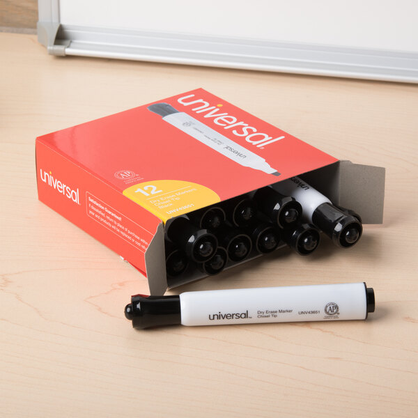 A box of Universal black chisel tip dry erase markers on a table.
