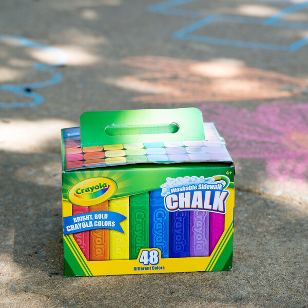 A close-up of a box of colorful Crayola sidewalk chalk.