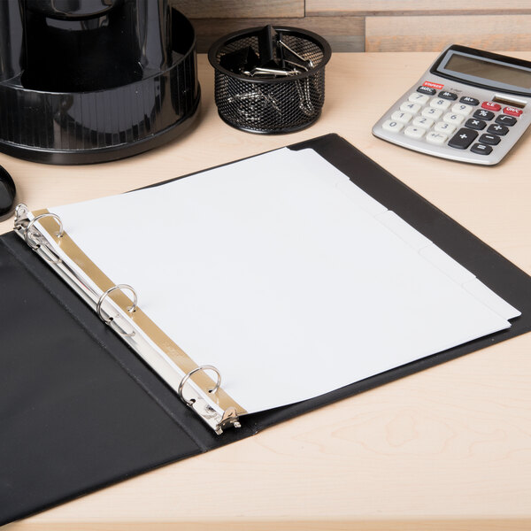 A binder with Avery Big Tab white dividers on a table with papers and a calculator.