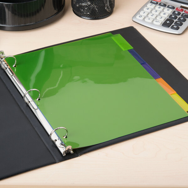 A black binder with green Avery 5-tab plastic dividers and a calculator.
