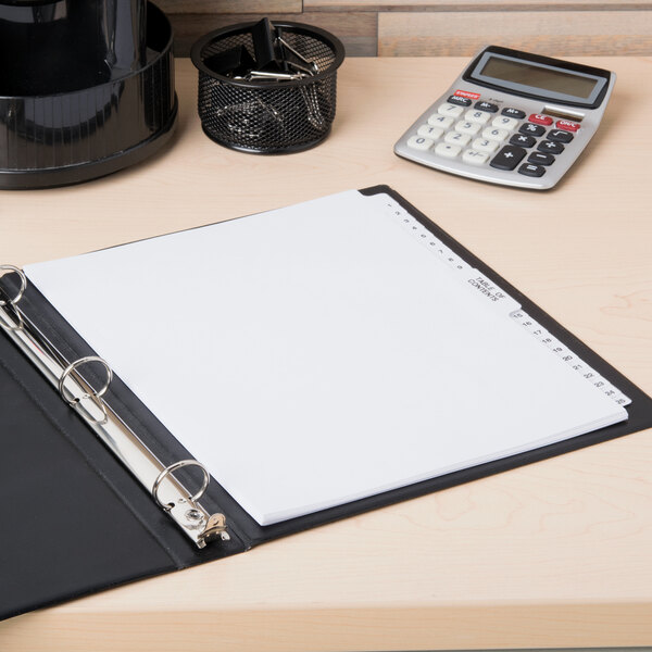 A binder with Avery Premium Collated Table of Contents Dividers with white paper on it.