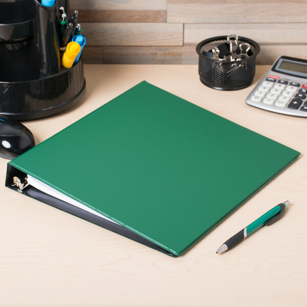 A green Avery Durable Non-View Binder on a desk.
