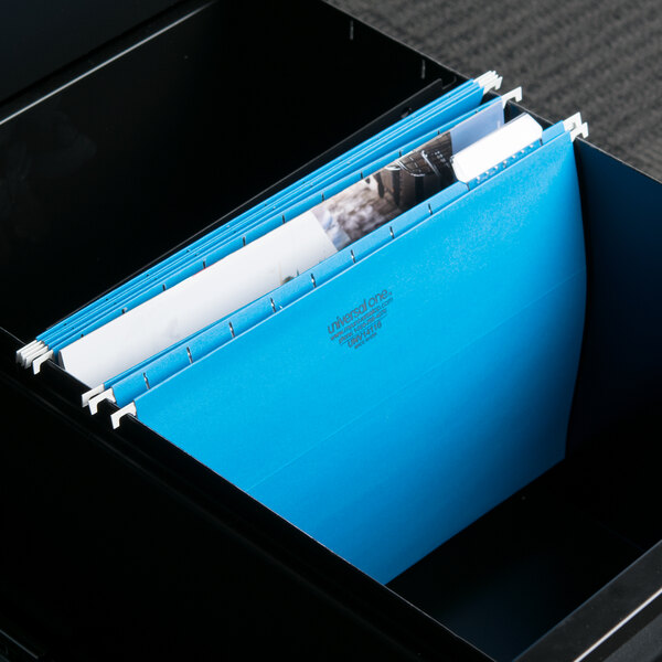 A file cabinet with blue UNV14116 hanging file folders inside.