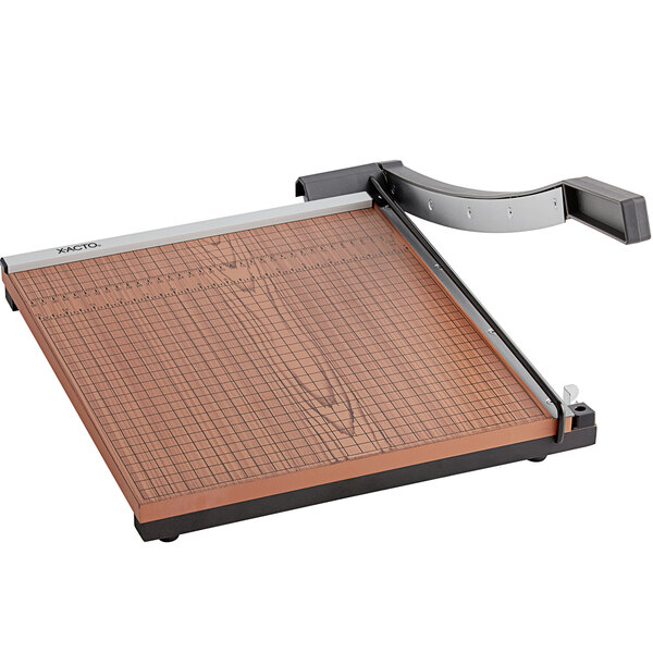 A X-Acto paper cutter with a wood base and metal frame.