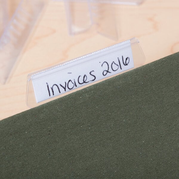 A file folder with a Universal clear plastic hanging file tab label.