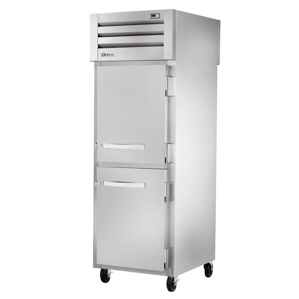 A white True pass-through refrigerator with a solid front and glass back.