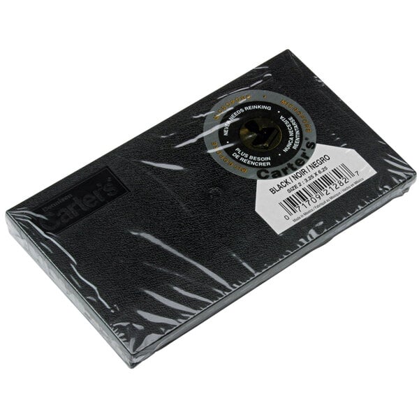 A black rectangular Avery stamp pad with a white label.