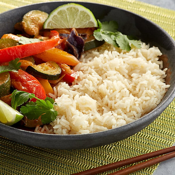A bowl of Royal Jasmine white rice and vegetables.