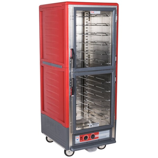 A red and silver Metro C5 heated holding cabinet with clear Dutch doors.