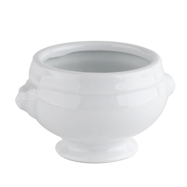 A white CAC Lion Head porcelain bouillon bowl with a handle.