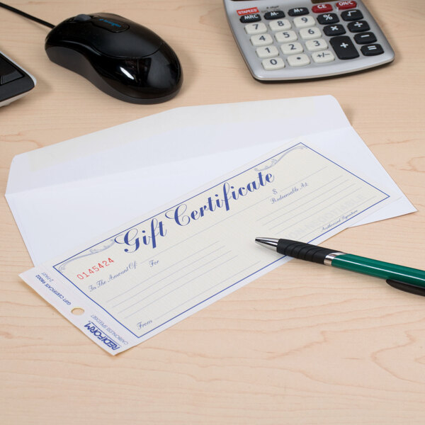 A Rediform blue and gold gift certificate on a desk with a green and black pen.