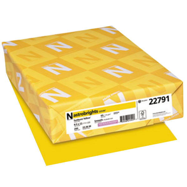 A yellow package of Astrobrights Sunburst Yellow cardstock with white text.