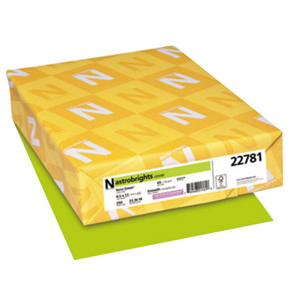 A yellow package of Astrobrights Terra Green cardstock paper with white letters and a white label.