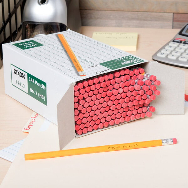 A box of Dixon Ticonderoga pencils on a desk.