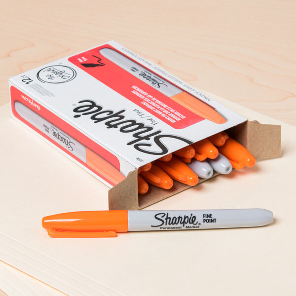 A box of Sharpie orange fine point permanent markers.