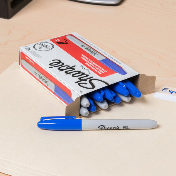 A box of blue Sharpie Fine Point Permanent Markers.