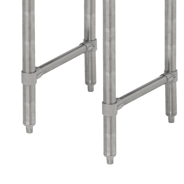Stainless steel legs for an Advance Tabco underbar table.