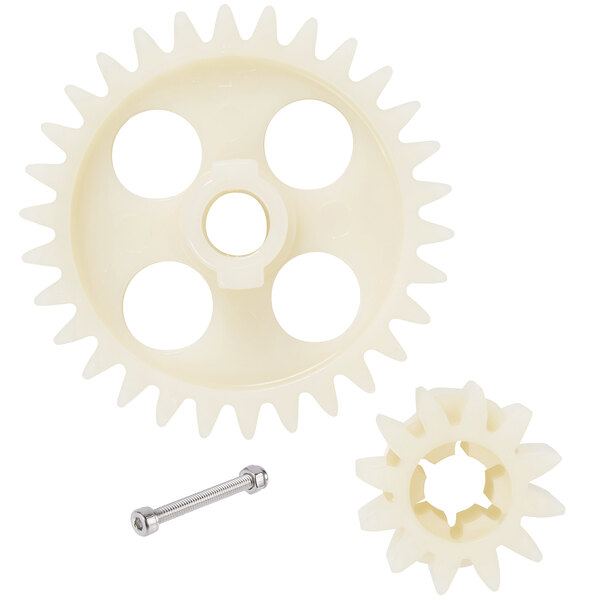 A white plastic gear with holes and a metal pin.