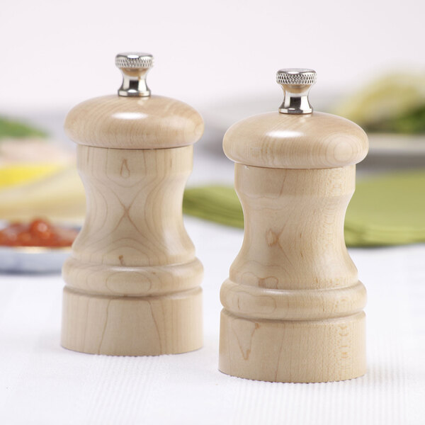 A Chef Specialties natural maple salt and pepper mill set on a table.