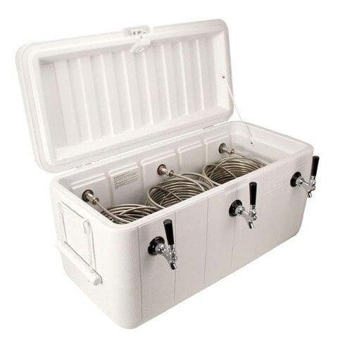 A white chest with three beer taps inside.
