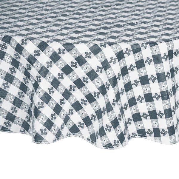 A blue gingham vinyl table cover with a checkered pattern on a table.