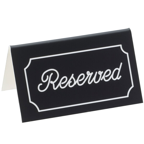 A black rectangular Cal-Mil "Reserved" tent sign with white text on both sides.
