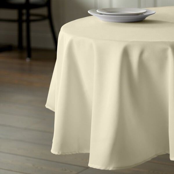 Intedge 83" Round Ivory 100% Polyester Hemmed Cloth Table Cover