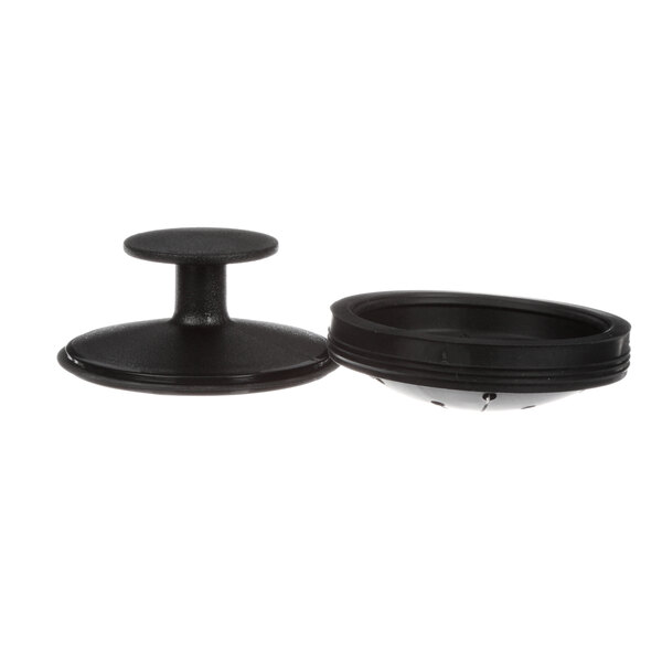 A black plastic round lid for a Waste King garbage disposal.