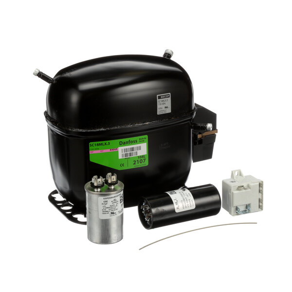 A black Manitowoc Ice compressor with a green and white electrical device.