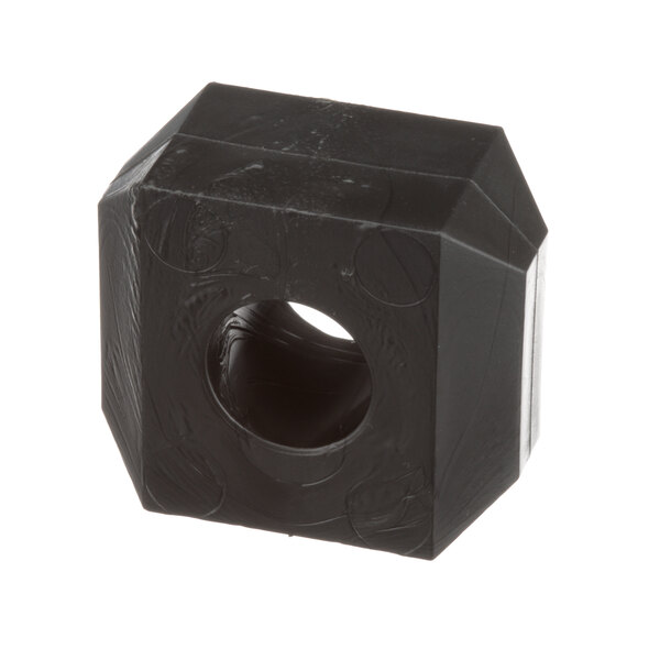 A black plastic Lincoln bearing block with a hole in it.