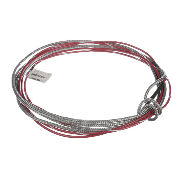 A close-up of a Continental Refrigerator door heater wire with red and silver wires.