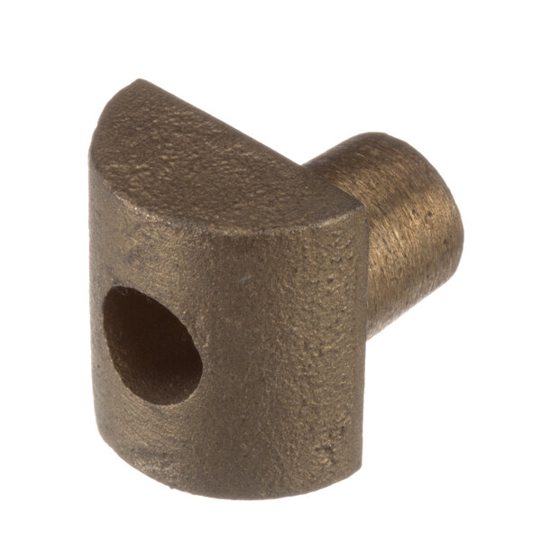 A close-up of a brass colored metal Blakeslee rocker guide with a hole in it.