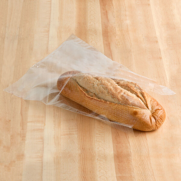 A loaf of bread wrapped in a LK Packaging plastic bag.