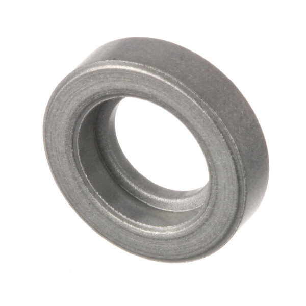 A close-up of a metal ring with a black rubber washer inside
