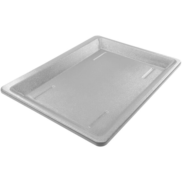 A white rectangular pan with a lid on a counter.